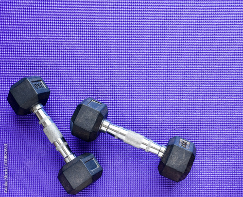 Two Dumbbells Weight 3 Kilogram Each On Purple Color Yoga Mat