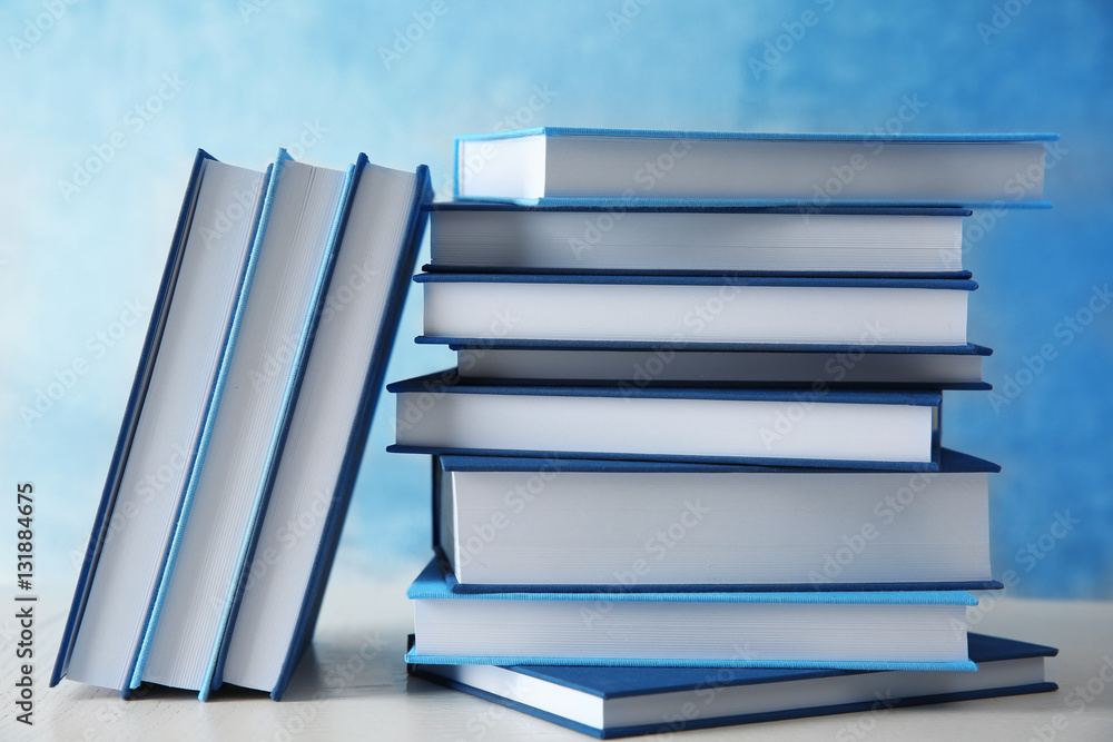 Stack of books on wooden background