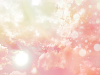Beautiful pink pastel sky with sun and cloud with bokeh effect