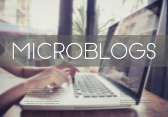 Wall Mural - business hand typing on a laptop keyboard with Microblogs homepage on the computer screen blogging social media online concept.