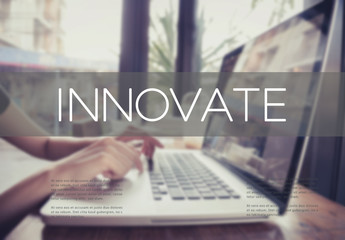 Wall Mural - business hand typing on a laptop keyboard with innovate homepage on the computer screen innovation t