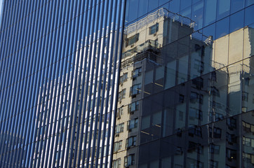 Midtown Manhattan NYC intersecting high-rise buildings architectural background reflections