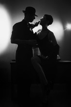 Film Noir: Romantic Loving Couple Embracing In The Dark, 1950s Style