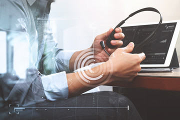 Poster - business man using VOIP headset with digital tablet computer doc