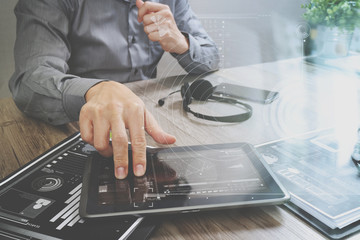Poster - Businessman hand using VOIP headset with digital tablet computer