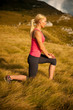 Women workout in nature making a lunge step