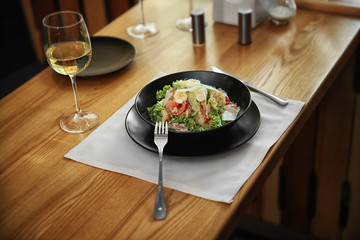 Poster - Plate with delicious salad on served table in cafe