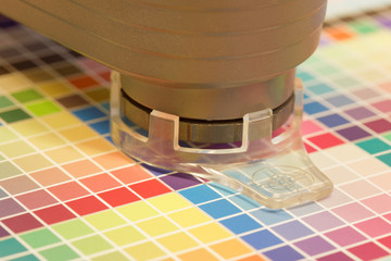 Spectrometer used for proofing on a leaf of the test print