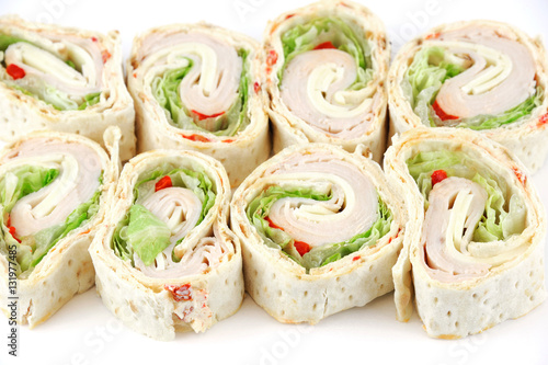 Fotografie, Obraz tortilla deli wrap rolls with ham vegetable isolated on white background