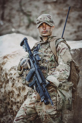 Army sniper during the military operation in the mountain. war,