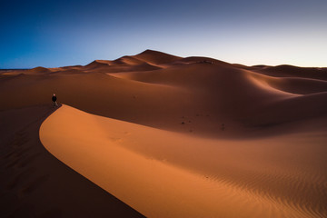  woman at Sunrise at the Dunes of Hassi Labiad, Morocco