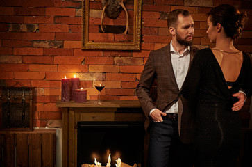 Wall Mural - Well-dressed couple in cozy home interior