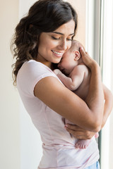 Wall Mural - woman with newborn baby