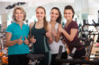 © caftor - glad females of different age training on exercise bikes