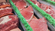 Rows of fresh raw meat on market
