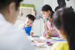 © Blue Jean Images - Little children painting in art class