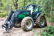 Green Tractor In The Woods