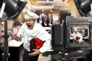 Wall Mural - cook chef in tv studio 