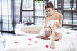 © Blue Jean Images - Beautiful young woman relaxing on massage table in a spa