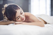 © Blue Jean Images - Beautiful young woman relaxing on massage table
