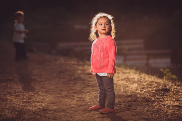 little girl posing on the ground