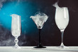 alcohol glasses with smoke at abstract smoke background