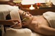 © Blue Jean Images - Beautiful young woman having facial treatment