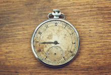 Vintage Pocket Watch On A Wooden Background