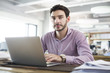 © Blue Jean Images - Male architect working with laptop in the office