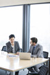 © Blue Jean Images - Business people talking in meeting room