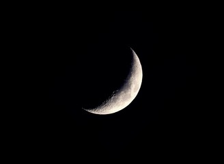 beautiful mystical half moon on dark night sky background with copy space