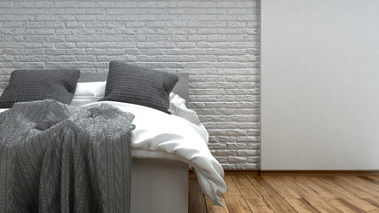 Unmade grey and white bed in a modern loft