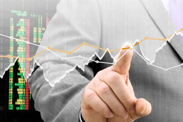 Fototapete - Businessman analyzing financial chart