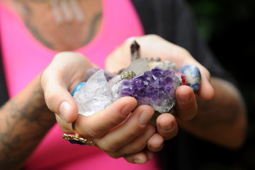 Wall Mural - Woman's hands holding crystals