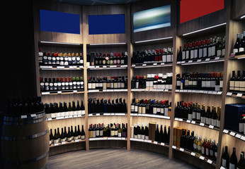 Poster - Wine bottles on wooden shelves at liquor store