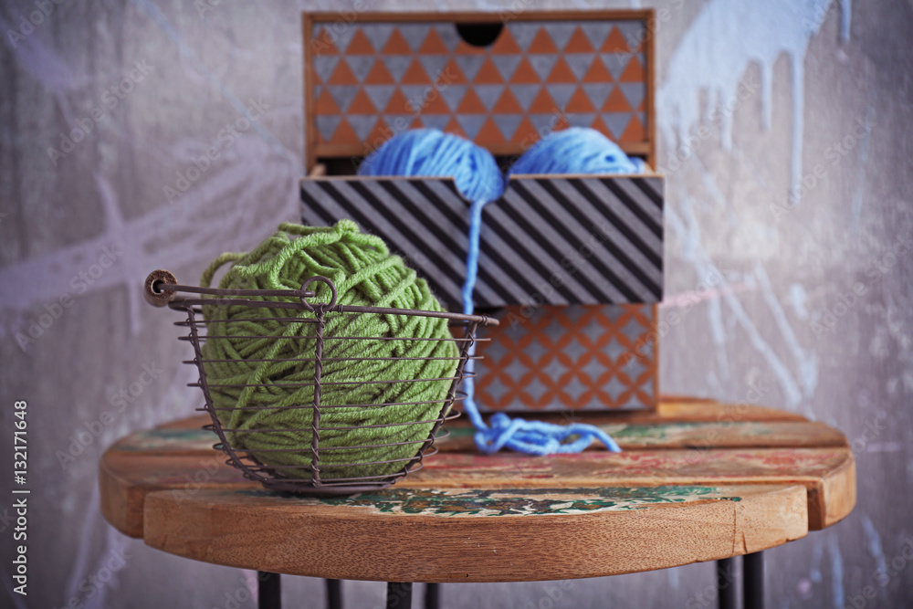 Ball of knitting yarn on wooden table