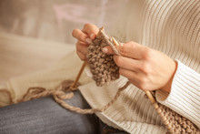Closeup Of Woman Knitting Warm Scarf