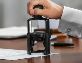 Sticker - Notary public in office stamping document