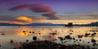 Pier in Tahoe City, California in Lake Tahoe at sunset with vivid clouds