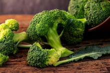 selective focus  fresh green broccoli on wooden 