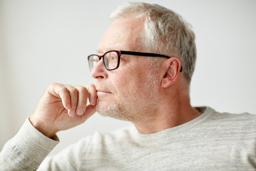 Sticker - close up of senior man in glasses thinking