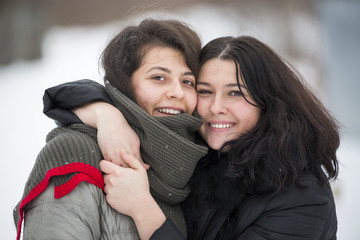 Smiling happy girls in winter