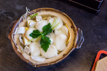 Traditional Shimabara Guzoni - soup with rice cake and seafood