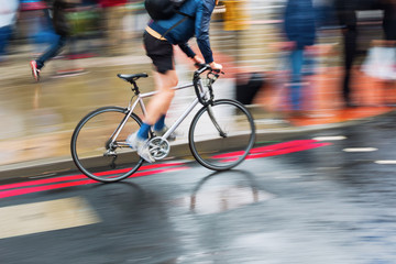 Sticker - bicycle rider on a wet street