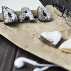 Happy Father's Day greetings - cookies and coffee on the desktop