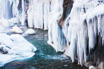 Wall Mural - Frozen waterfall in the mountains.