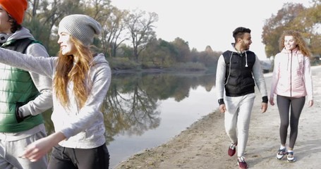 Sticker - Young People Group Walking Countryside Two Couple Outdoor Near River Shore, Friends Speaking Morning Autumn Park Natural Sun Lights Slow Motion 60 Fps