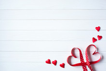 Wooden Background With Red Hearts From Ribbon