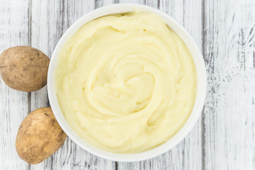 Wall Mural - Wooden table with Mashed Potatoes (selective focus)