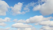 1 Minute Footage Loop Features Puffy Clouds Moving Along A Beautiful Gradient Blue Sky On A Bright, Sunny Day.